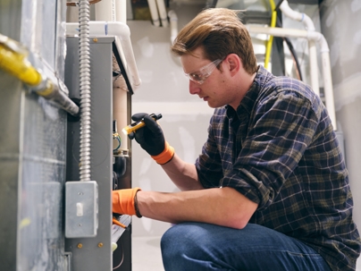 main inspecting a furnace