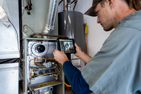 technician checking heating system